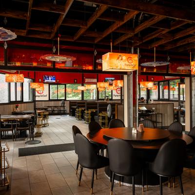Modern and spacious interior dining area with traditional Chinese decoration.