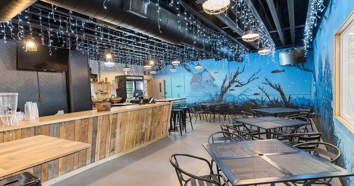 Spacious and cozy interior seating area and a long wooden bar counter