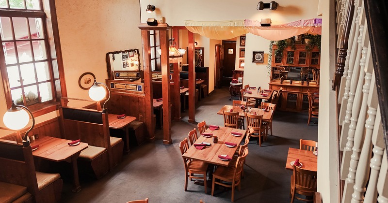 Restaurant interior, an upstairs view of the dining area with set tables