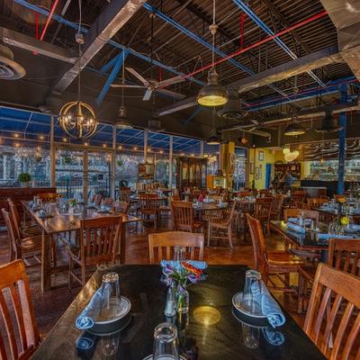 Interior, tables set up for dining.