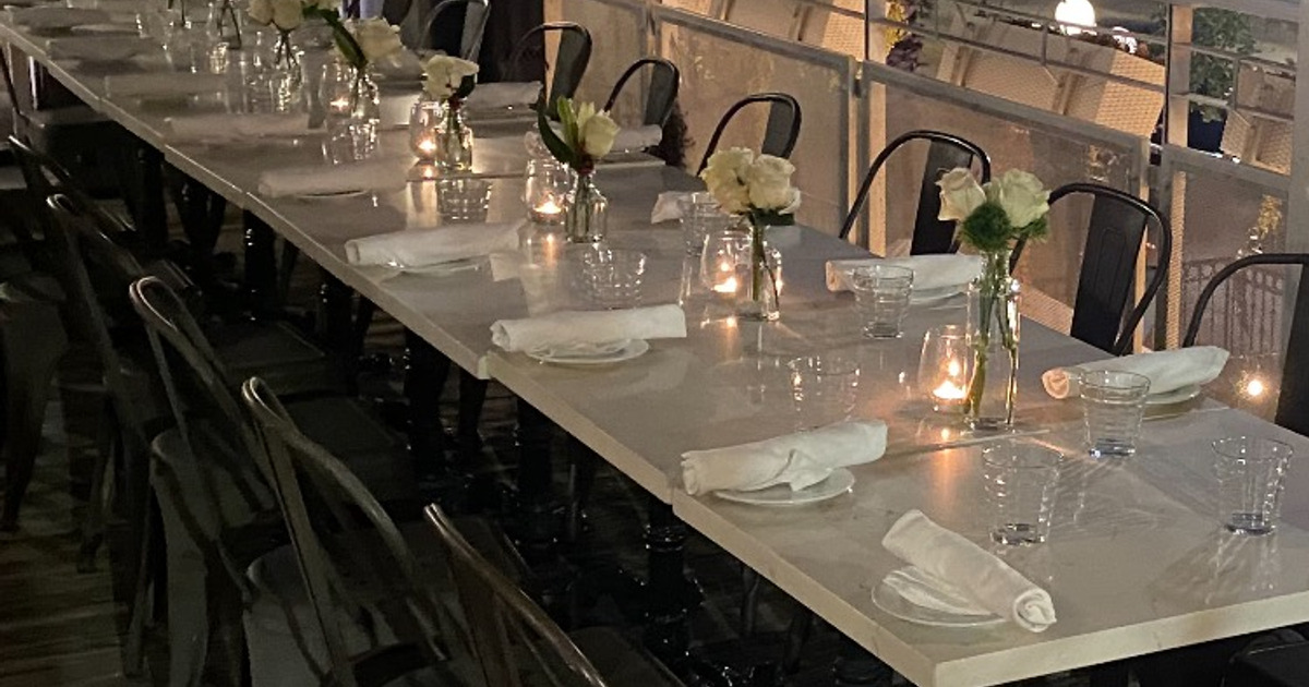 Table setting, tableware, candle light, and flowers