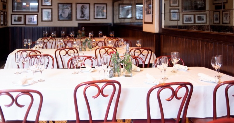 Interior, tables set for customers