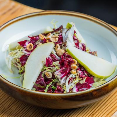 Salad with chicory, endives, toasted hazelnuts, and balsamic vinaigrette.