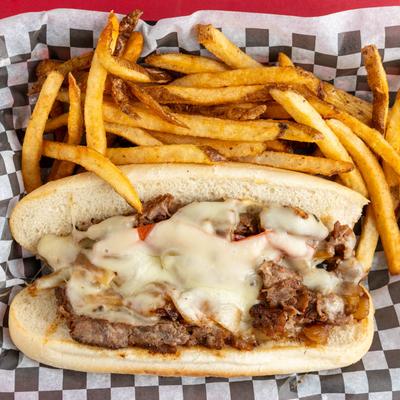 Philly Cheesesteak sandwich and fries.