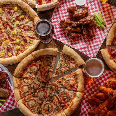 Various sliced pizzas, top view.