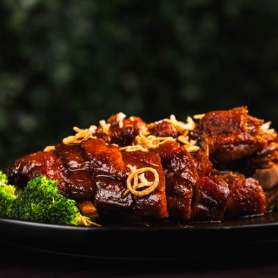 Crispy duck with broccoli and tamarind reduction.