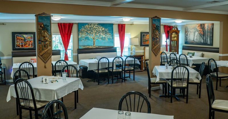 Interior, seating space with paintings