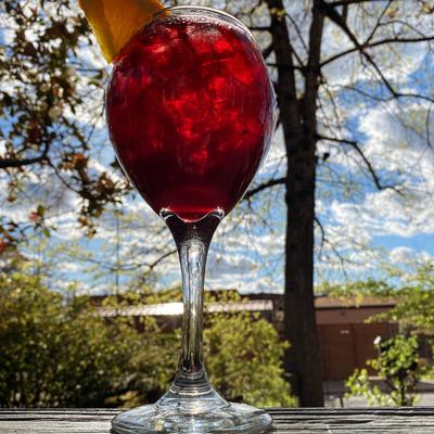 A wine glass outside in daylight.