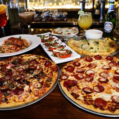 A table full of different dishes and drinks served.