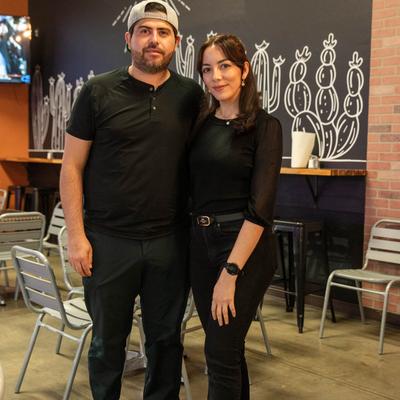 Owners in the restaurant, portrait shot.