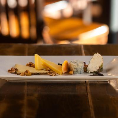A plate with assorted cheeses.