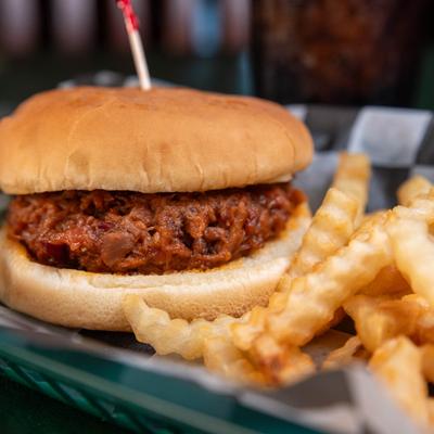 Chopped brisket sandwich served with crinkle fries.