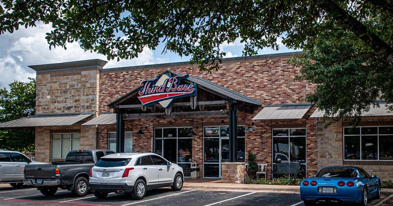 Bar's exterior, a car park in front