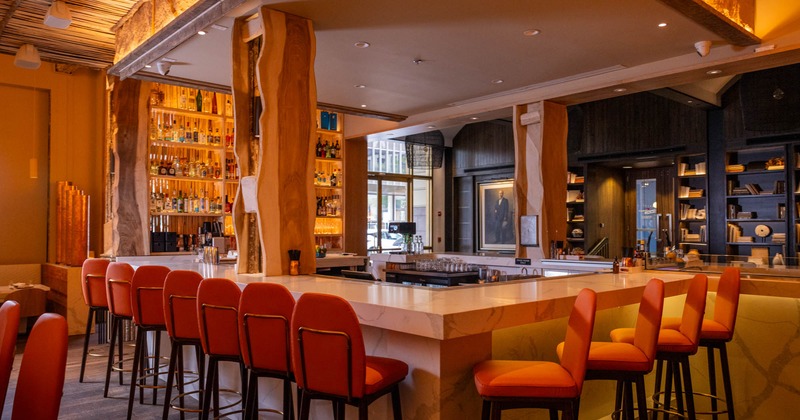 Bar area, neatly lined up bar stools