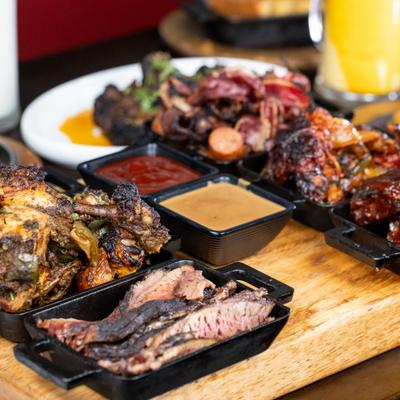 Meat Lovers BBQ Platter served on the table.
