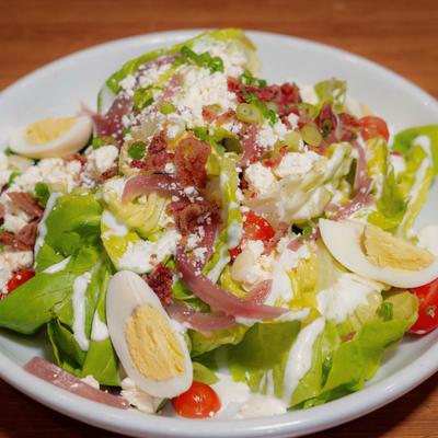 Cobb Salad, with bacon, hard boiled egg, feta, tomato, scallions, pickled red onion, and ranch.