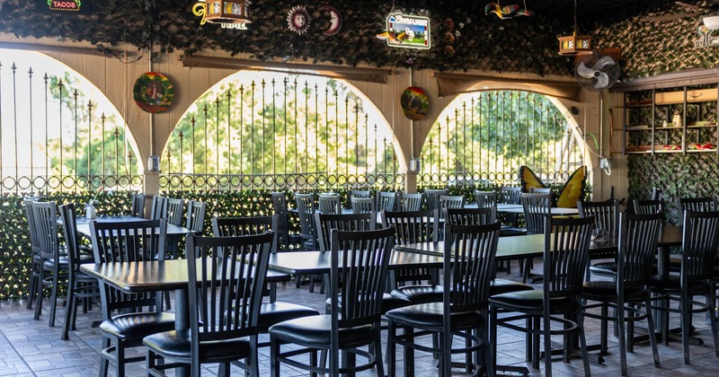 Covered seating area with chairs and tables