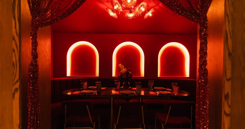 Isolated interior seating area with one table, chairs and a circular booth