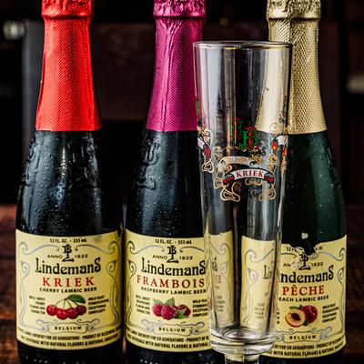 Assorted Belgian lambic beer with a glass.