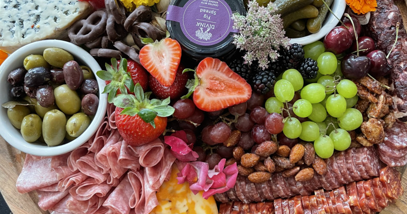 Charcuterie board, with mixed fruits and cheese