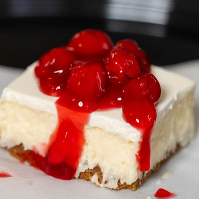 Cheesecake topped with cherry sauce.