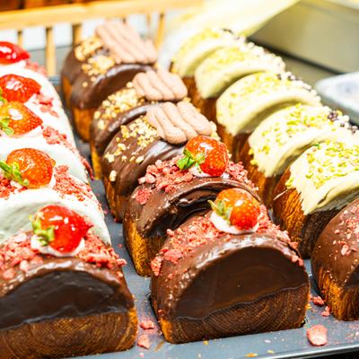 Rolly croissants displayed on a tray.