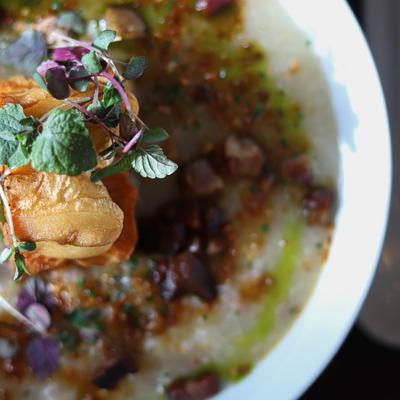 A close-up of rice porridge with pork.