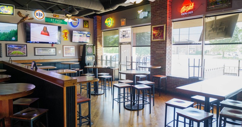 Interior seating area with bar tables and bar chairs