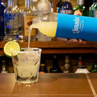 Staff member preparing cocktail