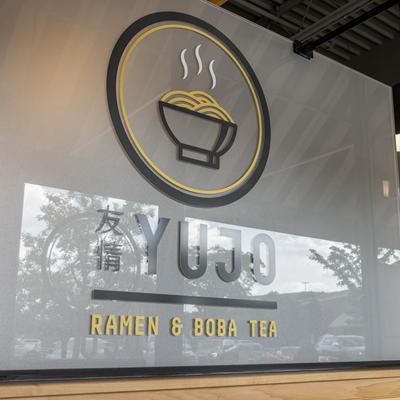 The signage for Yujo Ramen & Boba Tea.