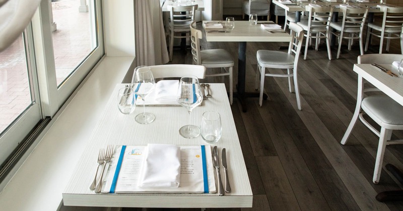 Interior, table setting by a window