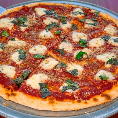 Margherita pizza with fresh mozzarella, tomato sauce, and basil.