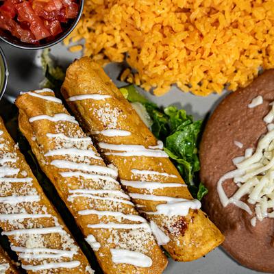 Crispy, topped taquitos with crema and cheese, served with salsa, rice and refried beans.