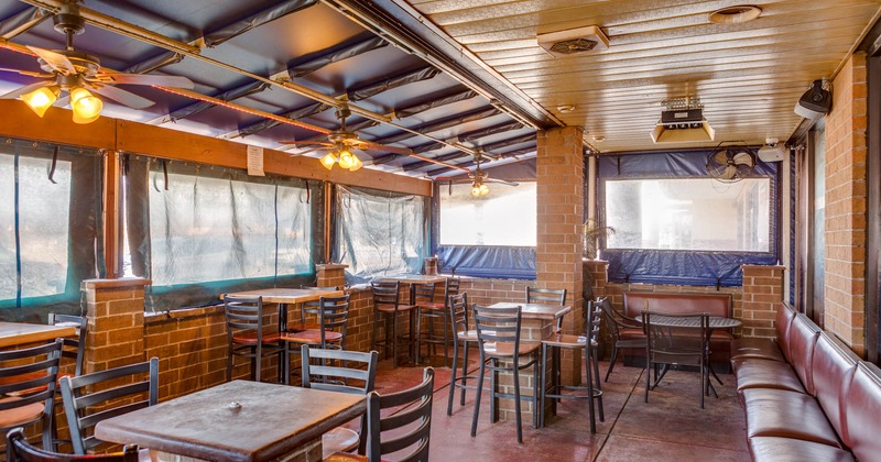 Covered patio area, tables and chairs