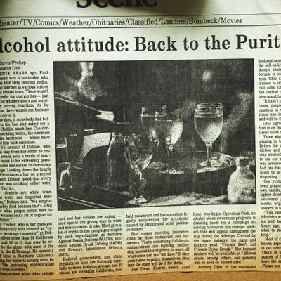 A newspaper article on alcohol use accompanied by a photo of glasses of wine