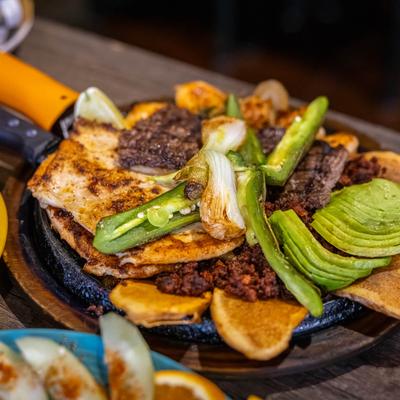 Chicken, steak, and shrimp fajitas.