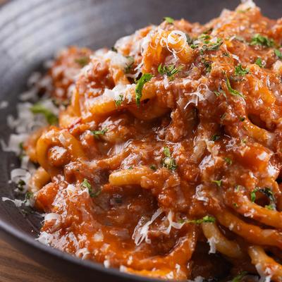 Spaghettoni pasta, with pork Bolognese, and cheese.