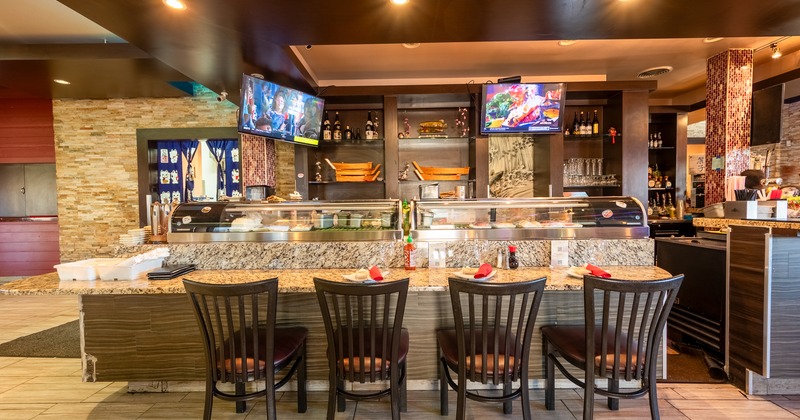 Food counter, preparation diner table, chairs, screens behind