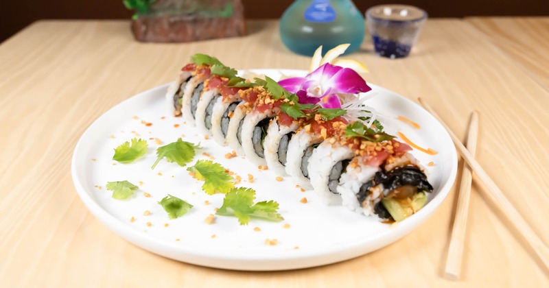Spicy Wahoo Roll served on a white plate with various garnishes