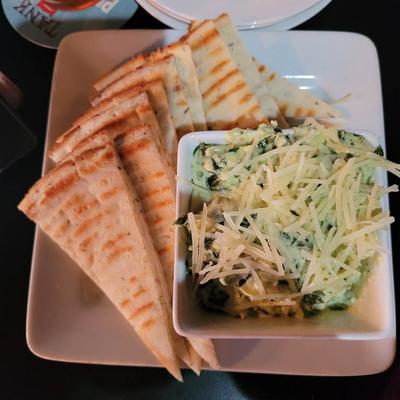 Spinach Dip with pita bread, overhead view.