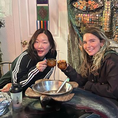 Guests making a toast with their kava drinks.