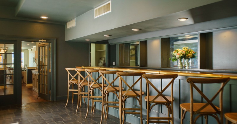 Interior, bar area, wooden top bar with wooden stools