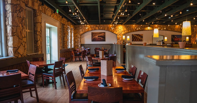 Interior, tables set for customers