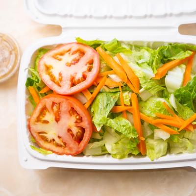 Salad with lettuce, carrots, and tomato.