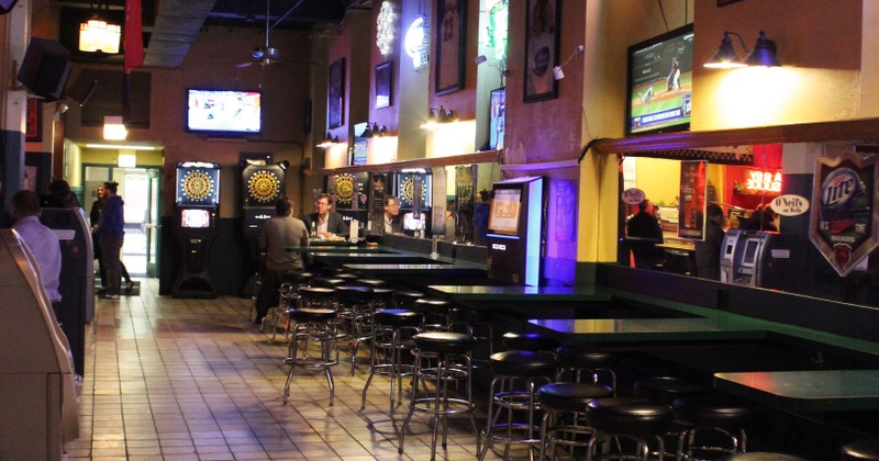 Restaurant interior, tables lined up, guests sitting