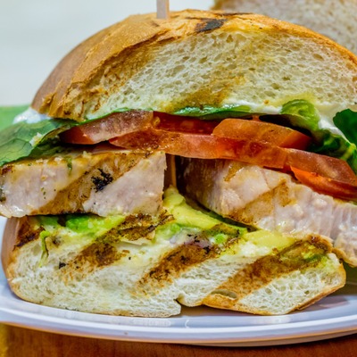 Grilled fish, avocado and tomato sandwich.