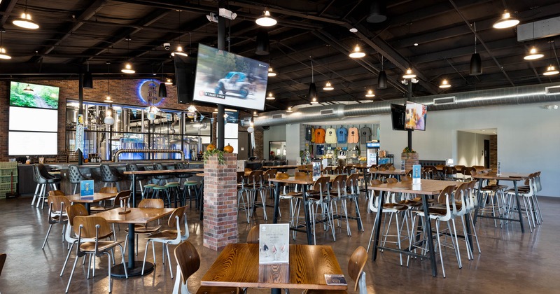 Interior, spacious seating area with tables and chairs