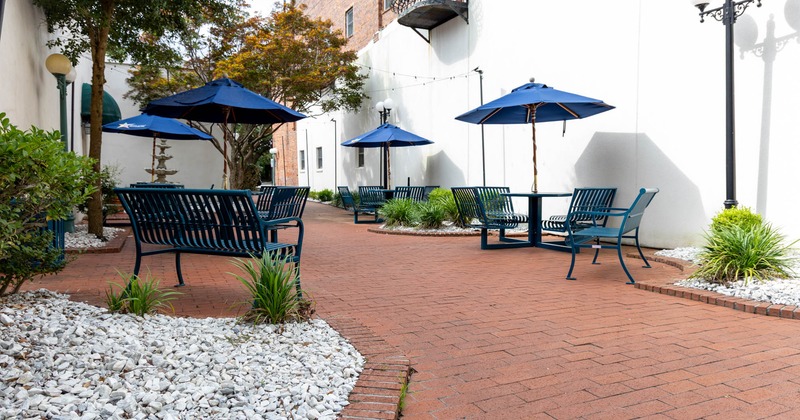 Exterior, patio, tables with parasols, chairs and benches