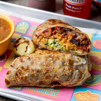 Burrito with a side of beans.