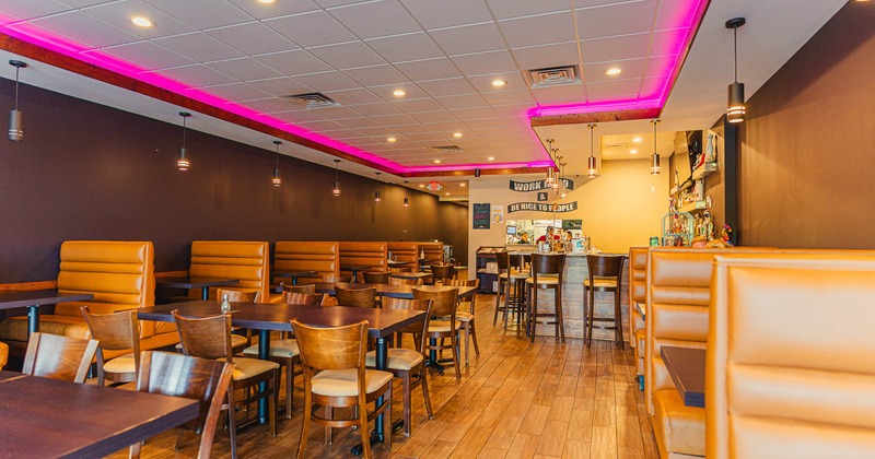 Interior, tables and chairs with booths ready for guests